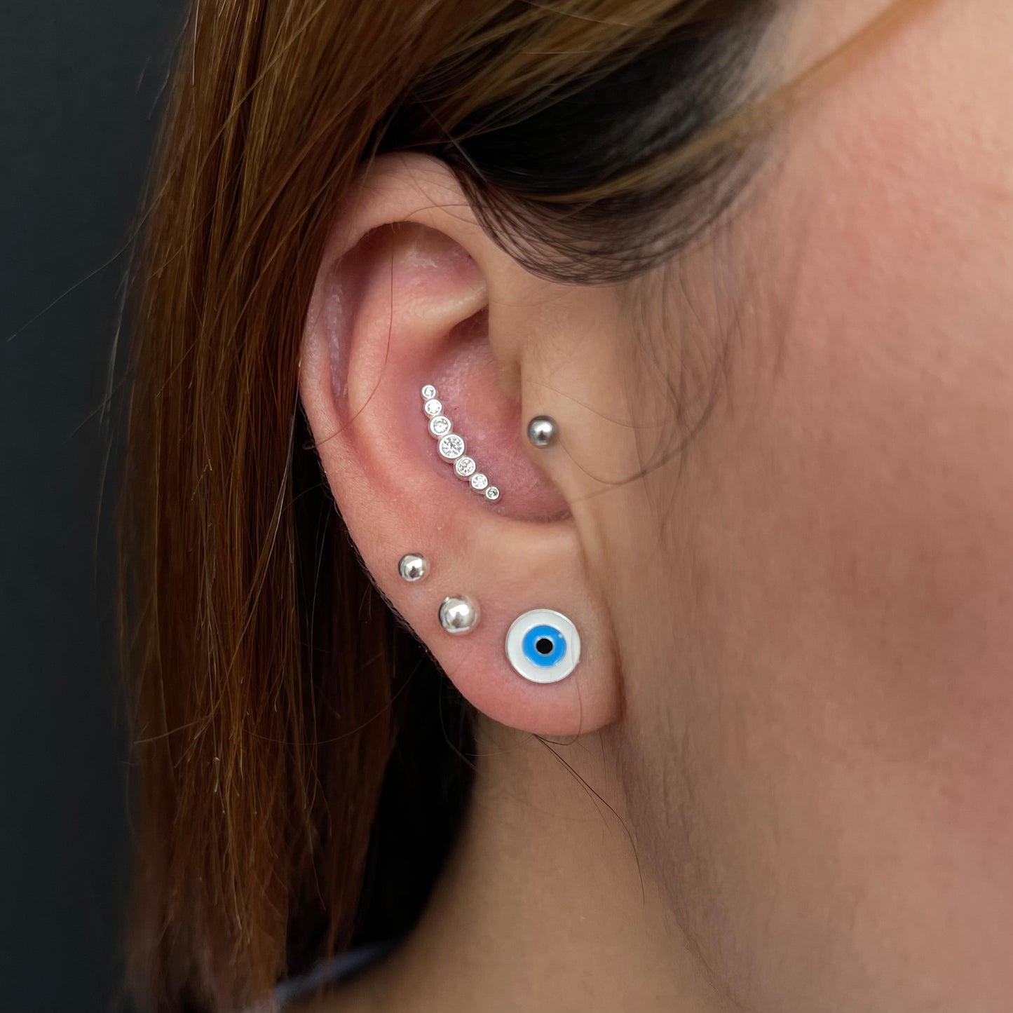Piercing cluster com zircônias